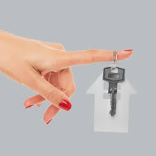 Promotional custom keyring being held by a females hand with red nail polish and a grey background